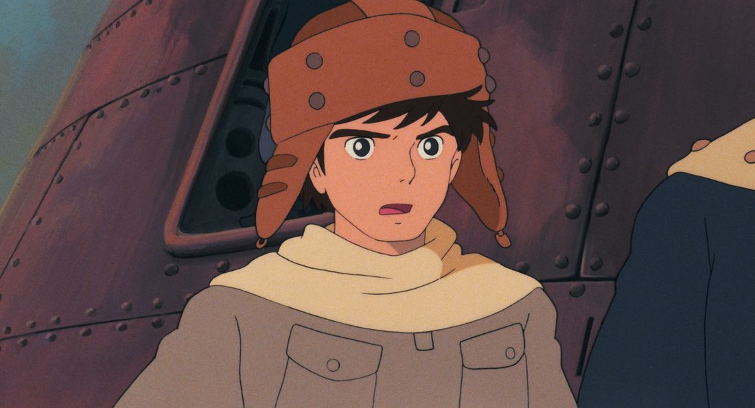 Asbel con el gorro de vuelo, dentro del casco metálico de una nave