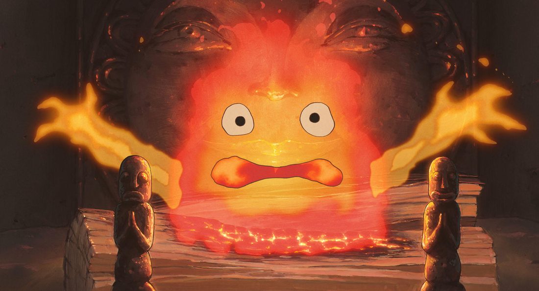 Calcifer en el hogar del castillo, con las llamas levantadas a los lados
