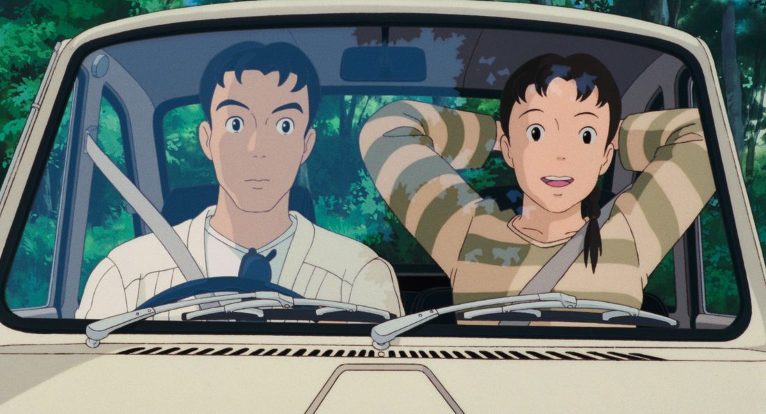 Toshio al volante de la furgoneta, con Taeko en el asiento de al lado