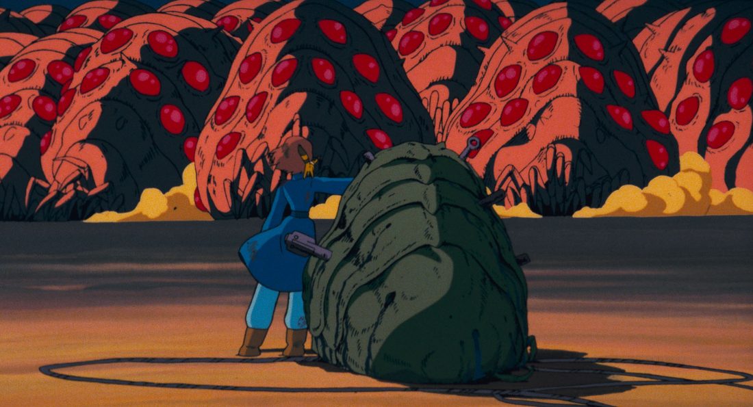 La manada enfurecida avanza mientras Nausicaä protege a la cría