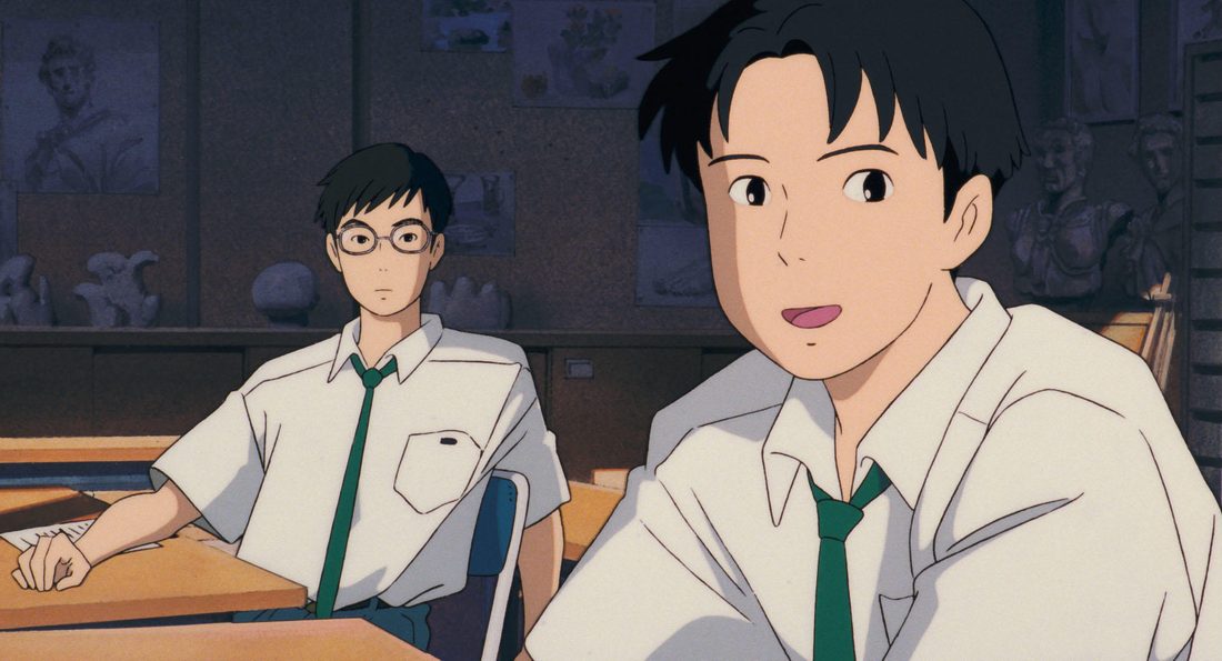 Yutaka en el pupitre, con Taku en primer término